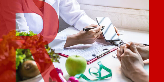 Nutritionist giving consultation to patient with healthy fruit and vegetables on the table