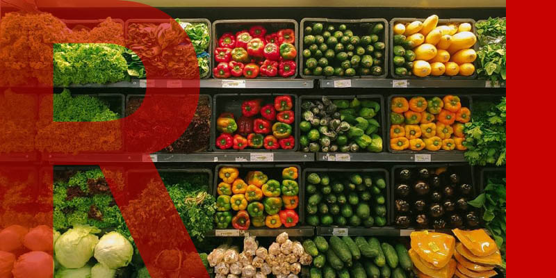 A supermarket wall of fruit and vegetables
