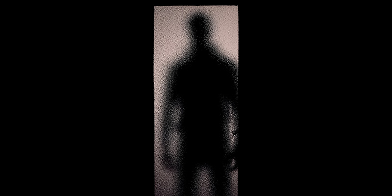 silhouette of person at door