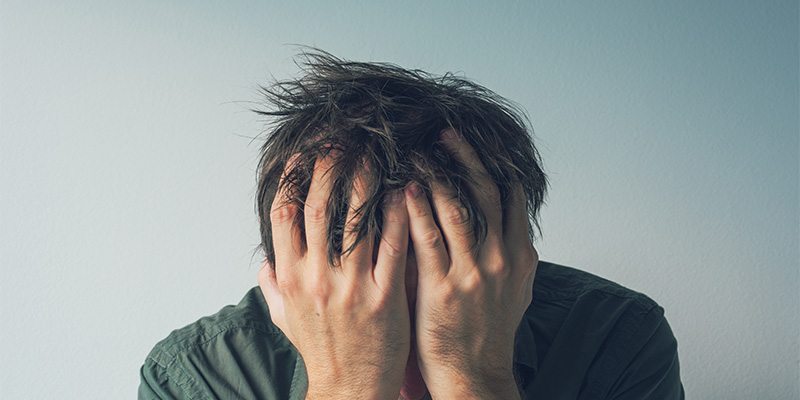 Person with head in hands