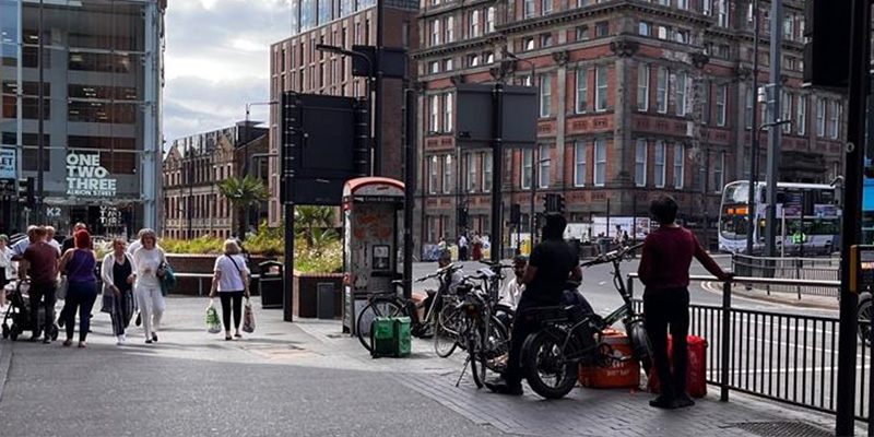 Cycle couriers waiting outside restaurant
