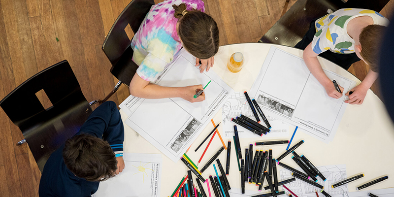 Children taking part in an interactive drawing session