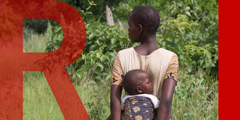 Mother carrying baby