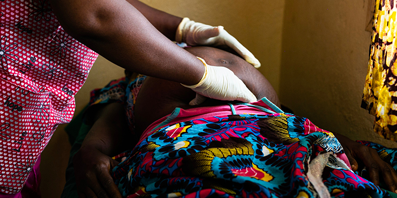 Nurse checks health of pregnant person