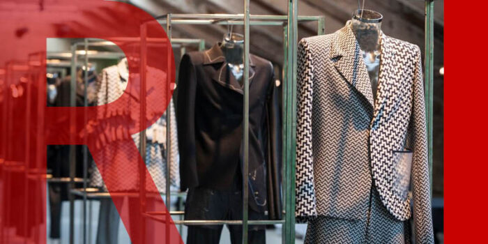 A rack of black and white wool suits with various patterns